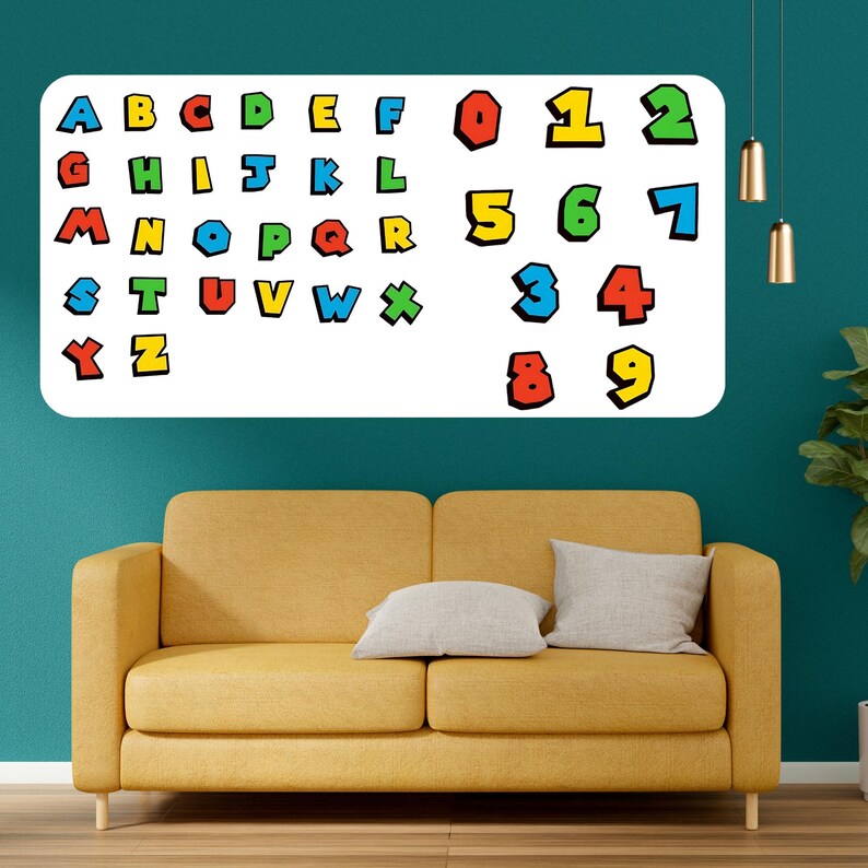May include: A white rectangular wall decal featuring colorful letters and numbers. The letters A through Z and numbers 0 through 9 are displayed in a playful, cartoon-like font. The decal is mounted on a teal wall above a yellow sofa.