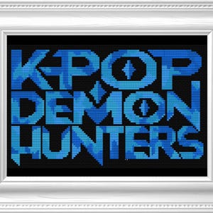 May include: A framed cross-stitch artwork with the words "KPOP DEMON HUNTERS" in blue pixelated letters on a black background. The artwork is in a white frame.