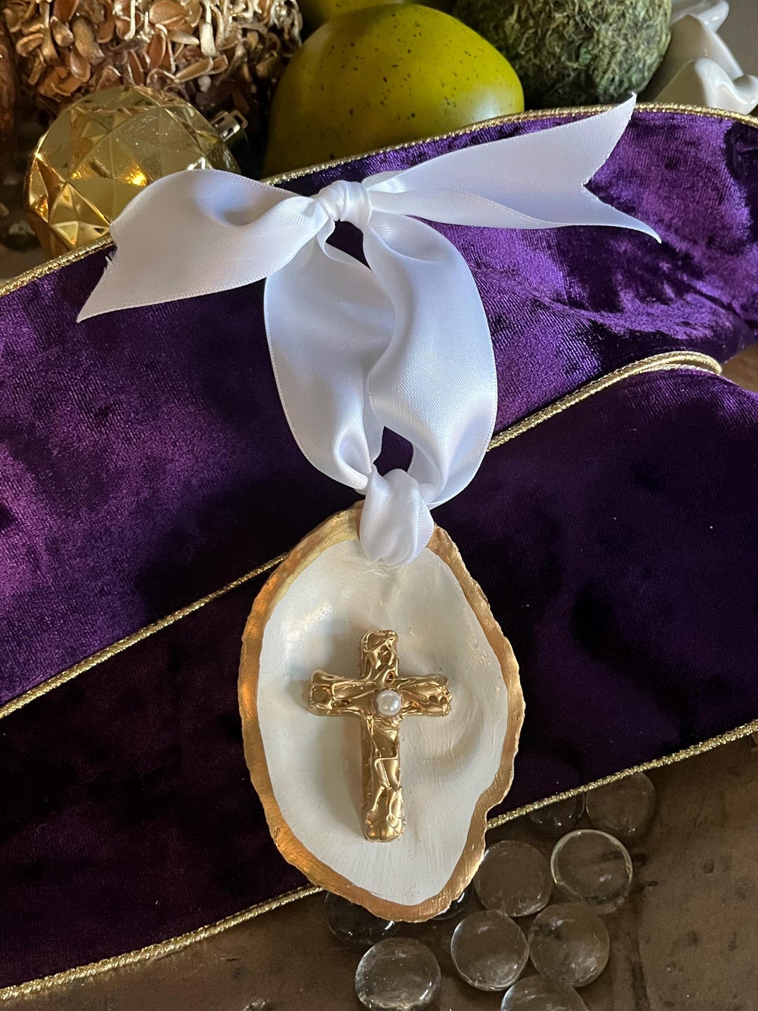 A handcrafted oyster shell cross by ML Design