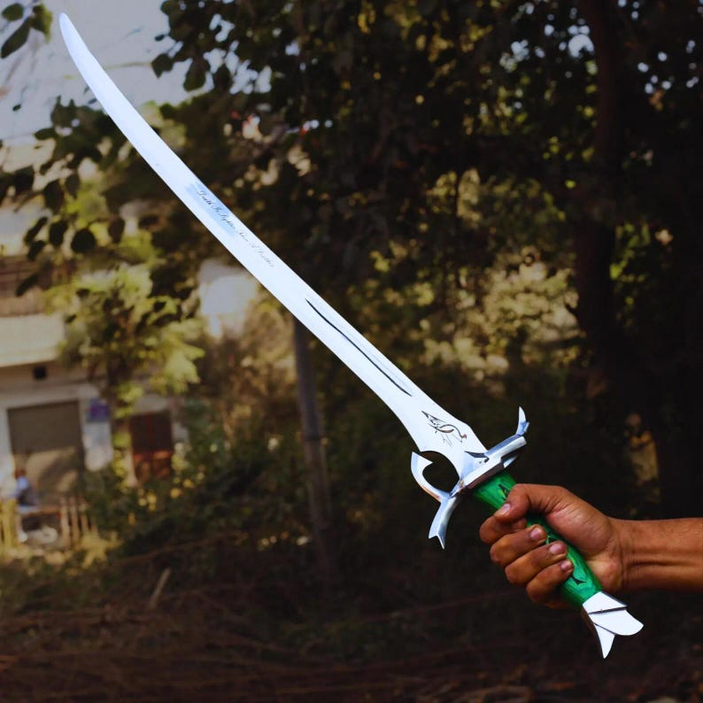 May include: A silver-colored sword with a curved blade and a green handle. The sword has intricate designs on the hilt and blade. The blade appears to be approximately 30 inches long.