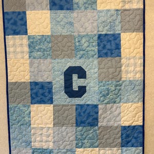 Baby Quilt:  With Large Initial and personalized Embroidered Label on the back.