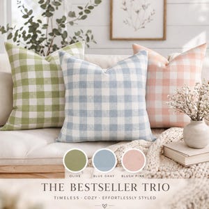 May include: A set of three ceramic mugs with a speckled, matte finish. The mugs are in shades of cream, light gray, and dark gray. Each mug has a simple, minimalist design, perfect for coffee or tea.