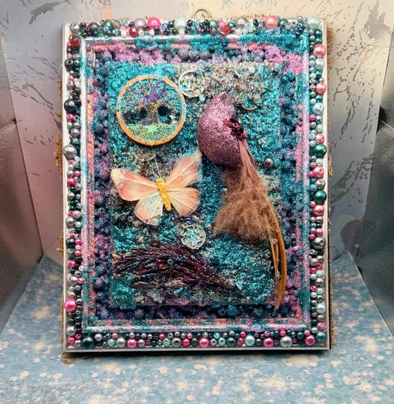 Canvas art featuring glitter, bird and butterfly motifs, mixed media, beaded decoupage, framed artwork.