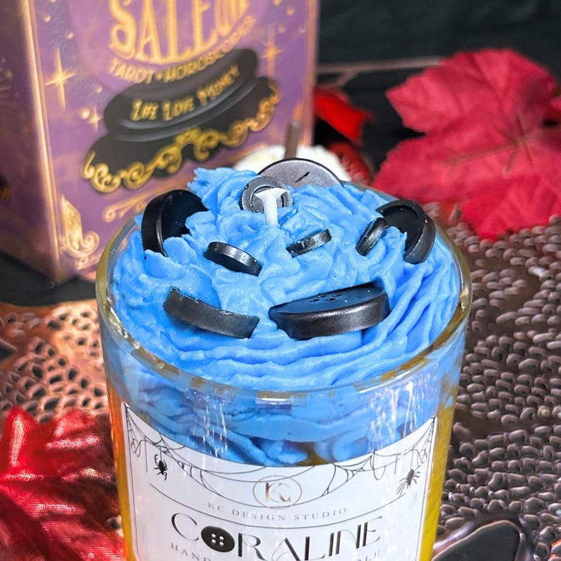 Close-up of Coraline candle black buttons and textured blue wax topping – handmade spooky soy candle perfect for gothic home and Halloween gifts.