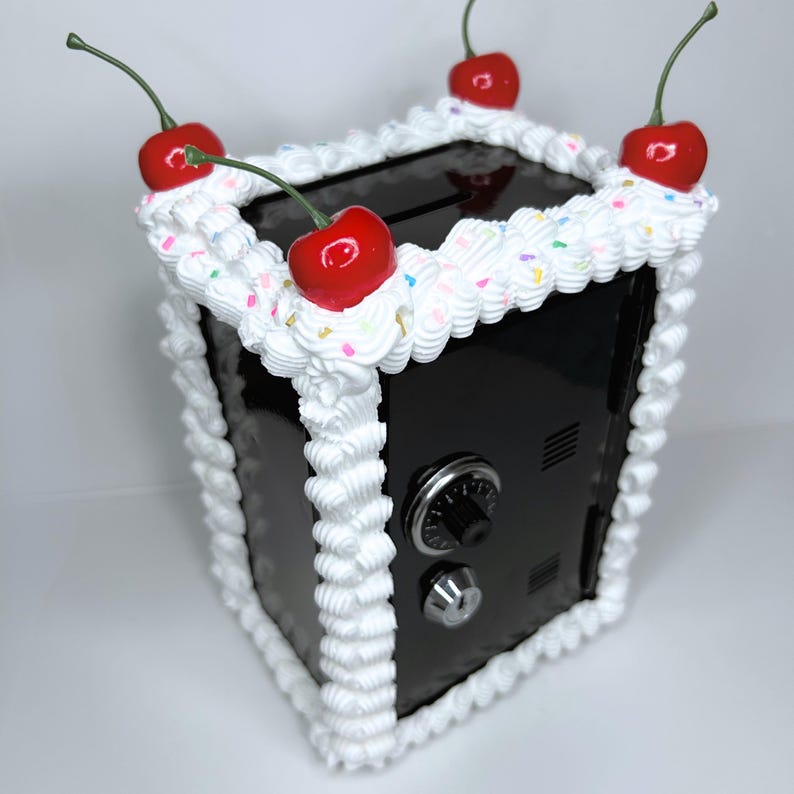 Side view of the black cake vault mini locker showing durable iron alloy build and frosting details.