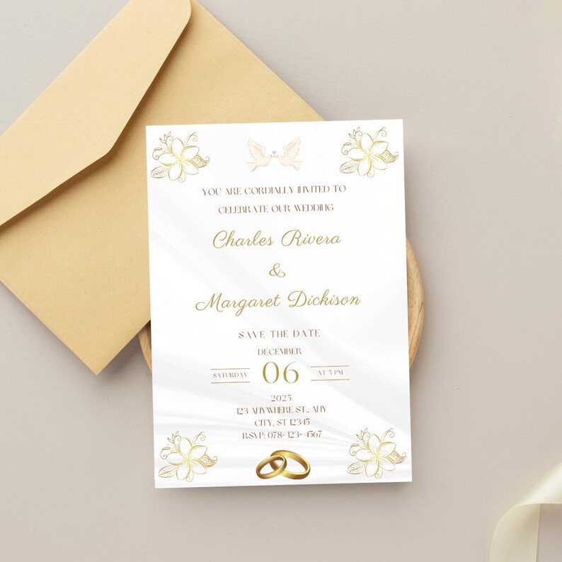 May include: A wedding invitation with gold floral and dove illustrations, featuring the names Charles Rivera and Margaret Dickison. The invitation is on white paper with gold text, and includes the date December 6, 2025, and RSVP information. An envelope is in the background.