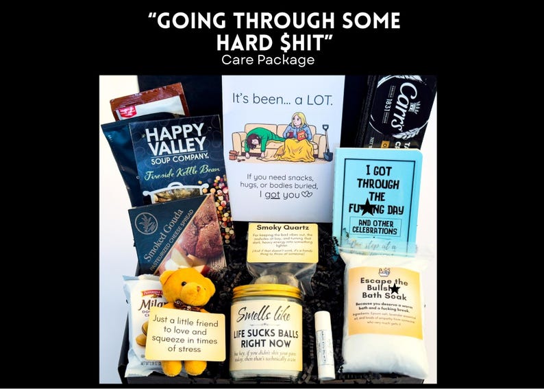 May include: A care package with the text "GOING THROUGH SOME HARD $HIT". The box contains snacks, bath soak, a teddy bear, a lip balm, and cards with humorous messages like "I got through the f*cking day".