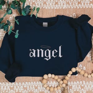Embroidered Angel Sweatshirt for Women, Angel Crewneck, Angel on Earth Sweater, Wings Sweatshirt, Angel Wings Sweater, Women's Fashion
Embroidered
Sweatshirt
Trend
Embroidered Crewneck
Gift For Her
Cute Sweatshirt
Trendy Sweatshirt
Embroidery Design
Best Gift
Angel On Earth
Angel Sweatshirt
Sweatshirt For Women
witchy gifts