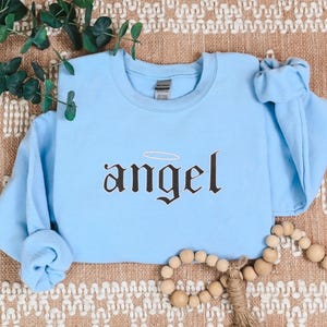 Embroidered Angel Sweatshirt for Women, Angel Crewneck, Angel on Earth Sweater, Wings Sweatshirt, Angel Wings Sweater, Women's Fashion
Embroidered
Sweatshirt
Trend
Embroidered Crewneck
Gift For Her
Cute Sweatshirt
Trendy Sweatshirt
Embroidery Design
Best Gift
Angel On Earth
Angel Sweatshirt
Sweatshirt For Women
witchy gifts