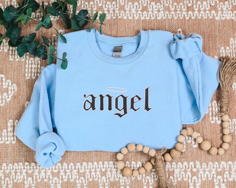Embroidered Angel Sweatshirt for Women, Angel Crewneck, Angel on Earth Sweater, Wings Sweatshirt, Angel Wings Sweater, Women's Fashion
Embroidered
Sweatshirt
Trend
Embroidered Crewneck
Gift For Her
Cute Sweatshirt
Trendy Sweatshirt
Embroidery Design
Best Gift
Angel On Earth
Angel Sweatshirt
Sweatshirt For Women
witchy gifts