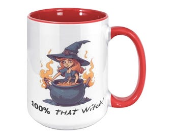 May include: White ceramic mug with a red interior and handle. The mug features a cartoon illustration of a witch stirring a cauldron, with the text "100% THAT Witch!" printed on the side. The witch is wearing a blue dress and a black hat.