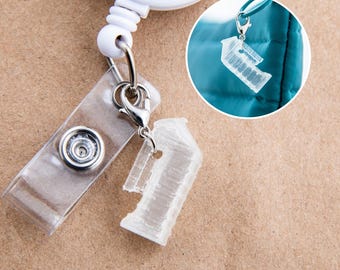 Funny nurse badge reel charms Medical Humor Mini Male Urinal for CAUTI Champion. Tiny urinal. Big nurse energy.