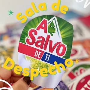 May include: A circular sticker featuring a green lime graphic and the text A Salvo DE TI in red and blue lettering. The design includes a small green cartoon character inside a white triangle against a green sunburst background with white accents.