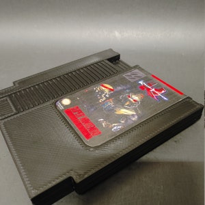 Super Nintendo Stash Case Killer Instinct avec tiroir magnétique caché qui s’ouvre avec un curseur s’adapte aux cartes mémoire
