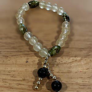 Handmade Cream, Green & Black Beaded Bracelet with Gold Dangle Charms