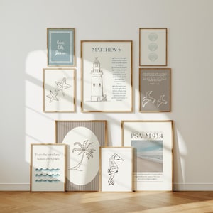 May include: A selection of framed art prints with a coastal theme. The prints feature illustrations of a lighthouse, seashells, starfish, a seahorse, palm tree, and ocean waves. Some prints include inspirational text.