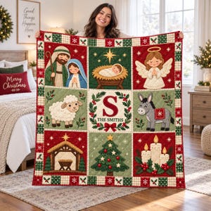 May include: A square Christmas quilt featuring a grid of nine panels with illustrations of the nativity scene, an angel, a sheep, a donkey, a manger, a Christmas tree, and candles, with a central monogram S and the text THE SMITHS.