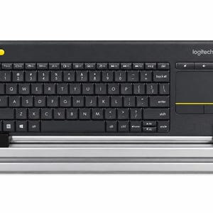 May include: A black Logitech wireless keyboard with an integrated touchpad on the right side. The keyboard features a yellow Bluetooth button in the top left corner and a yellow accent line on the touchpad. It is held upright by a silver metal stand.