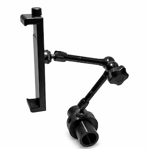 May include: A black adjustable mounting arm featuring a spring-loaded device clamp at one end and a cylindrical mounting base at the other. The articulated arm includes two segments connected by a central joint with a large, star-shaped locking knob.