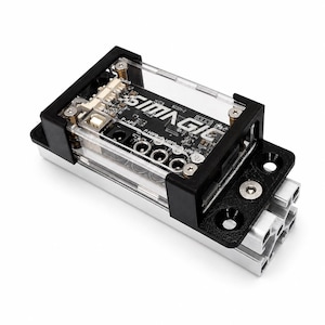 May include: A rectangular electronic control module with a black circuit board labelled SIMAGIC, enclosed in a clear protective casing. The unit features black mounting brackets, silver metal screws, and a silver aluminium extrusion base with mounting holes.