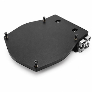 May include: A black, flat, shield-shaped metal plate featuring five protruding black screws and two recessed screws on its surface. The plate is attached to a silver-colored aluminum extrusion profile with a square cross-section at one end.