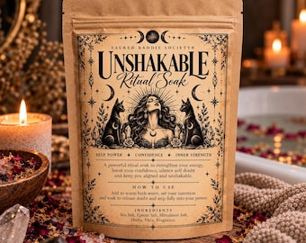 May include: A tan pouch of Unshakable Ritual Soak featuring black ink illustrations of a central figure, two cats, and celestial motifs. The text includes Sacred Baddie Society, Self Power, Confidence, Inner Strength, and ingredient lists.