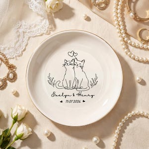 May include: A white ceramic mug with a black handle and the text "But First, Coffee" in a bold, black font. The mug is likely 310-425 ml in size, ideal for a morning beverage.