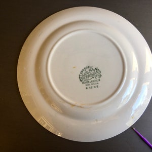 May include: White ceramic plate with a green and white logo that reads "Eggshell Georgian Homer Laughlin Made in U.S.A. # 42 N 5"