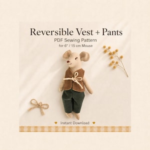 May include: A PDF sewing pattern for a reversible vest and trousers for a 15 cm mouse. The image features a beige mouse doll wearing a brown vest and dark green trousers, with a small twine bow and a sprig of dried flowers nearby. Text reads: Reversible Vest + Pants, PDF Sewing Pattern for 6" / 15 cm Mouse, Instant Download.