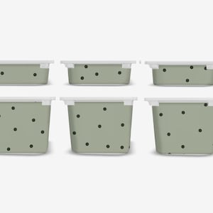 May include: Six sage green storage containers with white lids. Each container features a pattern of black polka dots. The containers are rectangular and come in various sizes, ideal for organising items.
