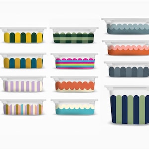 May include: A collection of rectangular containers with white lids and colorful patterned designs. The patterns include stripes, arches, and scalloped edges in various colors like yellow, green, blue, and pink. The containers are arranged on a white background.