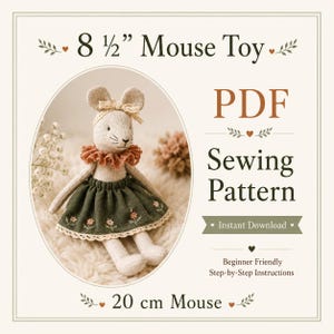 May include: A PDF sewing pattern for an 8 1/2 inch mouse toy. The image features a beige fabric mouse wearing a dark green skirt with floral embroidery, a lace collar, and a matching headband. The text reads 8 1/2" Mouse Toy, PDF Sewing Pattern, Instant Download, and 20 cm Mouse.