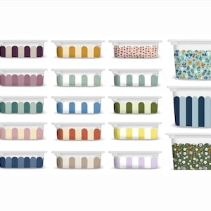 May include: A collection of rectangular containers with white lids and various decorative patterns. Designs include stripes, floral, and heart motifs in colors like blue, green, yellow, and red. The containers are likely for food storage or organization.