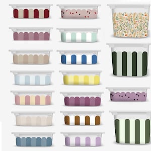 May include: A collection of rectangular storage containers with white lids. The containers feature various designs, including vertical stripes in colors like red, blue, and yellow, and floral and heart patterns. The containers are ideal for organizing items.