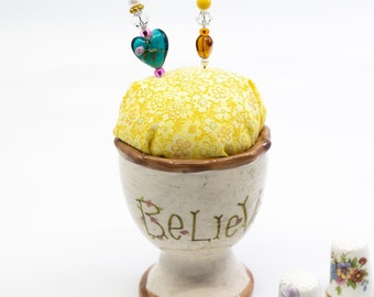 Pincushion and two straight pins beautifully decorated with beads and Swarovski crystals.