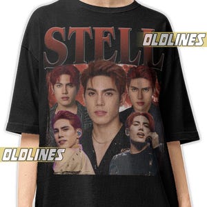 Puede incluir: Camiseta negra con un gráfico de un grupo de personas con cabello rojo. La palabra "STELL" está impresa en letras rojas grandes en la parte superior. La camiseta tiene el texto "OLDLINES" impreso.