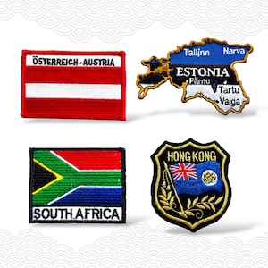 May include: Four embroidered patches featuring flags and country names. Includes Austria, Estonia, South Africa, and Hong Kong. The Austria patch is red and white. The Estonia patch is blue, black, and white. The South Africa patch is green, yellow, red, black, and blue. The Hong Kong patch is blue, gold, and red.