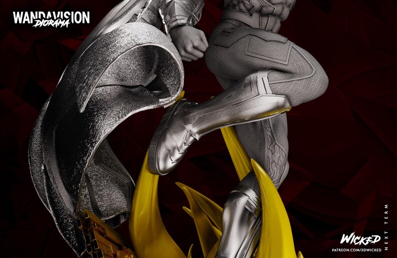 May include: A monochrome diorama depicting figures in futuristic outfits, with yellow energy effects. The words "WandaVision Diorama" are at the top left. The artist's name and website are at the bottom right.