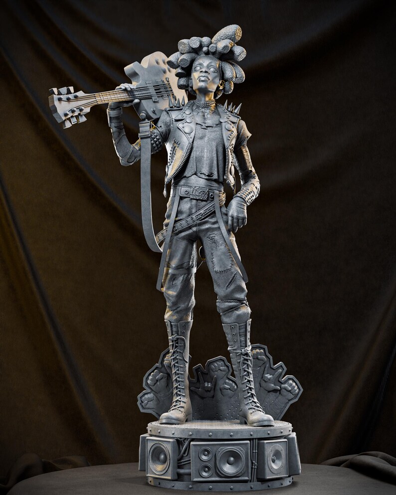 May include: A gray statue of a person holding a bass guitar, wearing a studded jacket, pants, and boots. The statue stands on a base with speakers. The figure has dreadlocks and a determined expression.