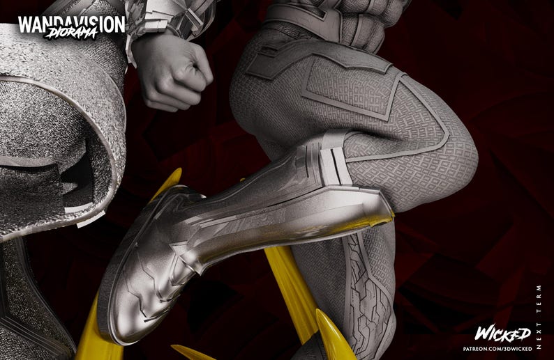 May include: A grayscale diorama figure of a character in a futuristic suit, with detailed paneling and metallic accents. The figure is in a dynamic pose, with a yellow element. The text "WandaVision Diorama" is visible.