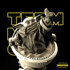 May include: A detailed 3D model of Grogu from Star Wars, seated in his floating pram, reaching for a butterfly. The figure is in a neutral color palette, set against a black background with yellow text that reads "TEAM" and "STAR WARS" logo.