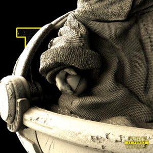 May include: A sepia-toned image of a character from the Star Wars universe. The character is nestled in a textured, light-colored cradle, with a hand holding a small, round object. The character is wrapped in a textured blanket and wearing a hat. The Star Wars logo is visible.
