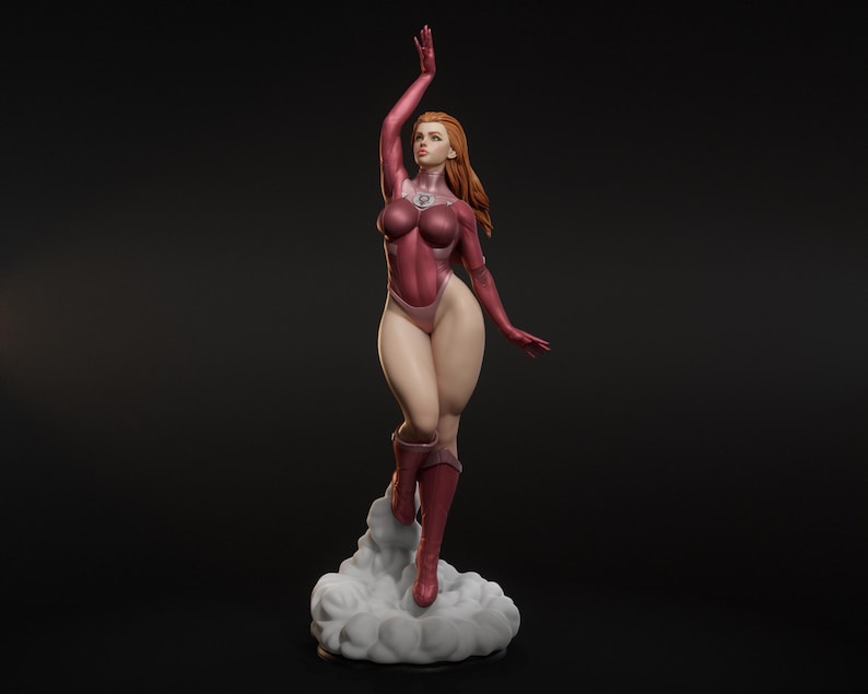 May include: A detailed figurine of a woman in a red bodysuit, boots, and gloves, with her right arm raised. The figure has long red hair and is standing on a cloud-like base. The background is a solid black.