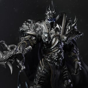 May include: A detailed figure of a warrior in ornate silver and black armour. The character has a horned helmet, glowing blue eyes, and a menacing expression. The figure is holding a large, bladed weapon, with a dark cape.