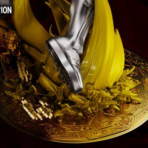 May include: A detailed diorama featuring a silver boot stepping onto a golden, ornate base. The base is surrounded by yellow, flame-like structures. The words "WandaVision Diorama" are visible in the upper left corner.