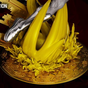 May include: A golden diorama base with a stylized yellow flame design and a silver figure's leg. The base has intricate patterns and the text "WANDAVISION DIORAMA" and "WICKED". The background is dark red.