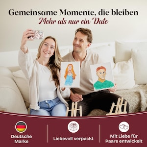 May include: A painting kit for couples featuring two blank canvases, two wooden easels, and two hand-painted portraits. The text reads: Gemeinsame Momente, die bleiben. Mehr als nur ein Date. Deutsche Marke. Liebevoll verpackt. Mit Liebe f&uuml;r Paare entwickelt.
