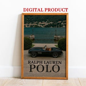 May include: Wooden framed print featuring a black convertible car parked in front of a lake. The print includes the text "RALPH LAUREN POLO" in a bold, sans-serif font. The words "DIGITAL PRODUCT" are at the top.