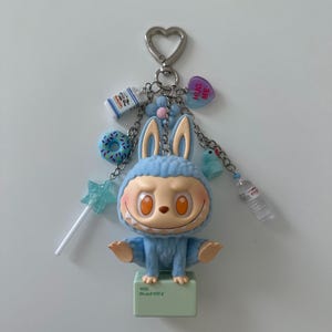 The Monsters PopMart lazy yoga series figure keychain | bag charm