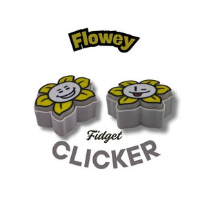 May include: Two flower-shaped fidget clickers with yellow petals and smiling faces. The clickers are grey with yellow accents and the word "Flowey" is above them. The words "Fidget CLICKER" are below the clickers.